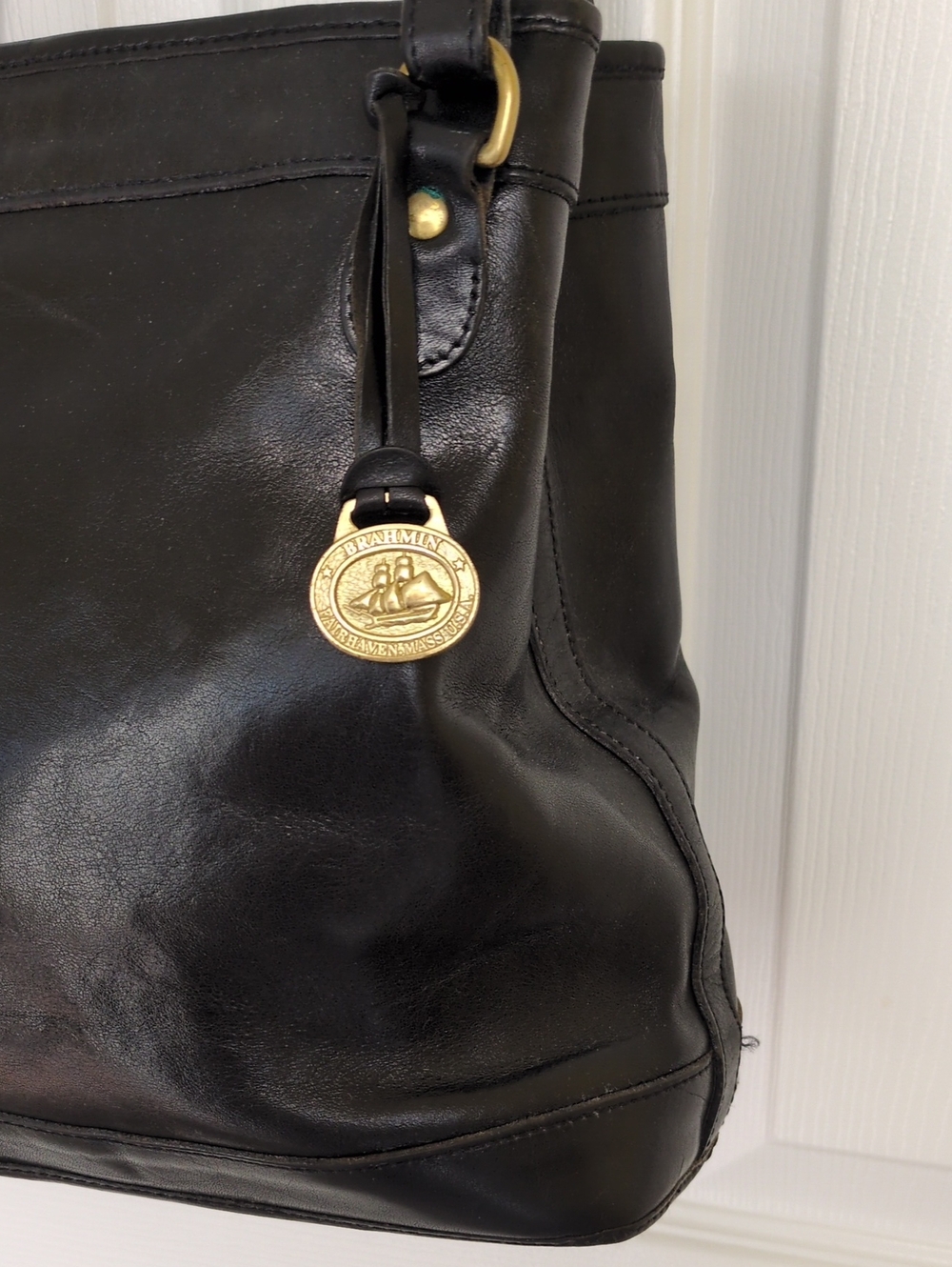 Brahmin Black Leather Tote with Gold Medallion